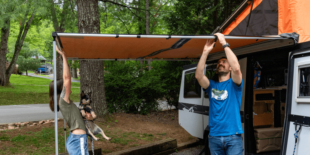 couple setting up campsite